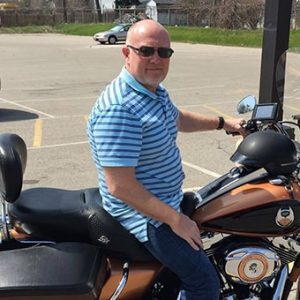 Dean Schoen sitting on a motorcycle